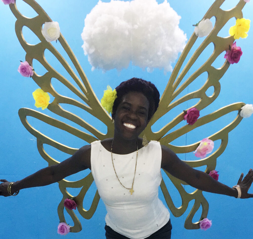 Me standing in front of butterfly art installation