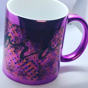 Metallic ceramic mug with a colorful print on it