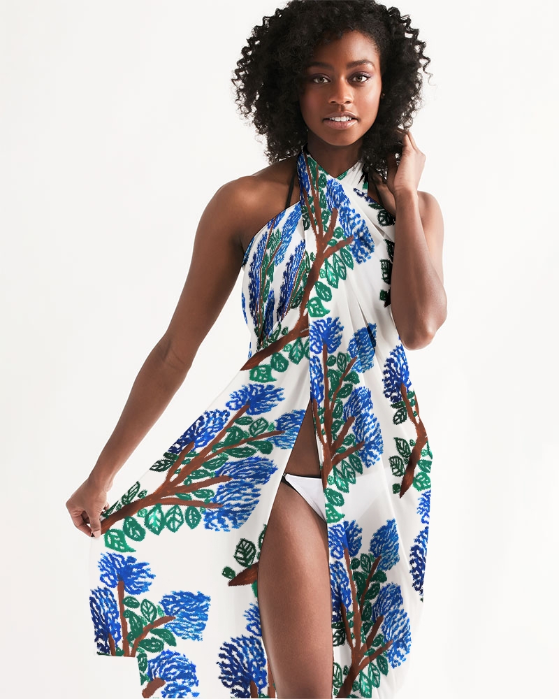 Model wearing a sarong with plant designs 