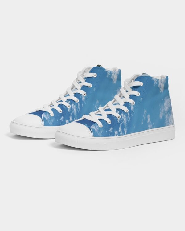 Photo of a pair of Hightops with a photograph of a bright blue clear sky on it